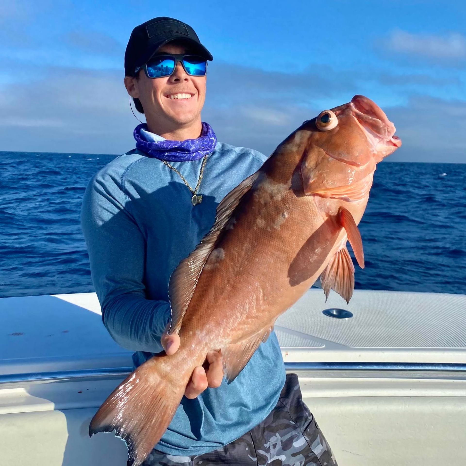Captain Daniel Delph with a grouper